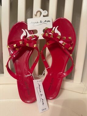 Anna & Ava Red Jelly Bow Sandals with Gold Pyramid Studs